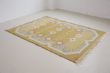 Luisa is a Swedish röllakan rug by textile designer Karin Jonsson. This unique rug features a beautiful ochre yellow colour palette and a geometric design