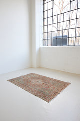 Tallulah is an antique Mahal rug. This carpet features an incredible palette of soft terracotta, blues and greens and a stunning intricate design.