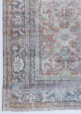 A 100‑year‑old Persian Mahal rug handwoven from natural wool and featuring an all over floral design.
