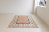 This vintage Swedish rug features a beautiful and unique colour palette and a geometric design.