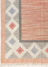 This is an original vintage röllakan rug signed by the renowned textile designer Karin Jonsson. This vintage rug features a beautiful and unique colour palette and a geometric design.