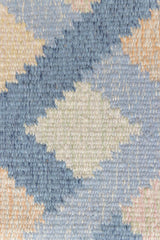 This is a vintage Swedish rug, colourful kilims often feature strong lines and designs inspired by floral and botanical motifs.