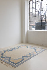 This is a vintage Swedish rug, colourful kilims often feature strong lines and designs inspired by floral and botanical motifs.