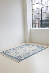 This rug shows beautiful tones of blue, this vintage kilim is featuring bold geometric design with hints of pink within the motifs in the carpet.