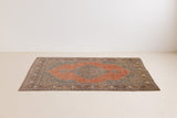 Selma is a beautiful antique Persian Tabriz rug with a soft yet bold coral colour palette and a stunning abrash and patina with a lovely central medallion.