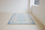 This beautiful vintage Swedish flatweave rug features a stunning blue colour palette and an elegant geometric design.
