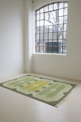 Alf is a vintage rug handwoven in Sweden for Svensk He Mslöjd which is a 1899 founded non-profit association that focused on Swedish textiles. This beautiful flatweave features a stunning green colour palette and an elegant geometric design.