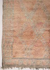 Aliya Beni M’guild vintage thick pile carpet. Peach coloured with a grey geometric pattern.