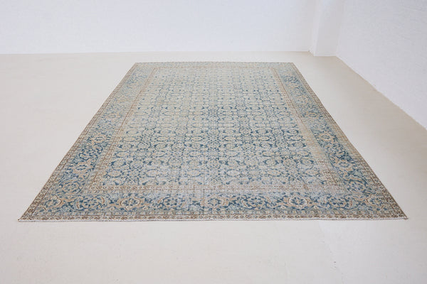 This is a handmade antique Tabriz rug, woven in Persia. The Tabriz region is known for producing some of the most ornate Persian carpets, often known for their mesmerising and intricate repeating patterns.