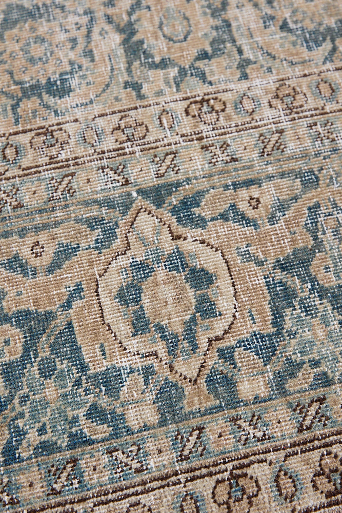 This is a handmade antique Tabriz rug, woven in Persia. The Tabriz region is known for producing some of the most ornate Persian carpets, often known for their mesmerising and intricate repeating patterns.