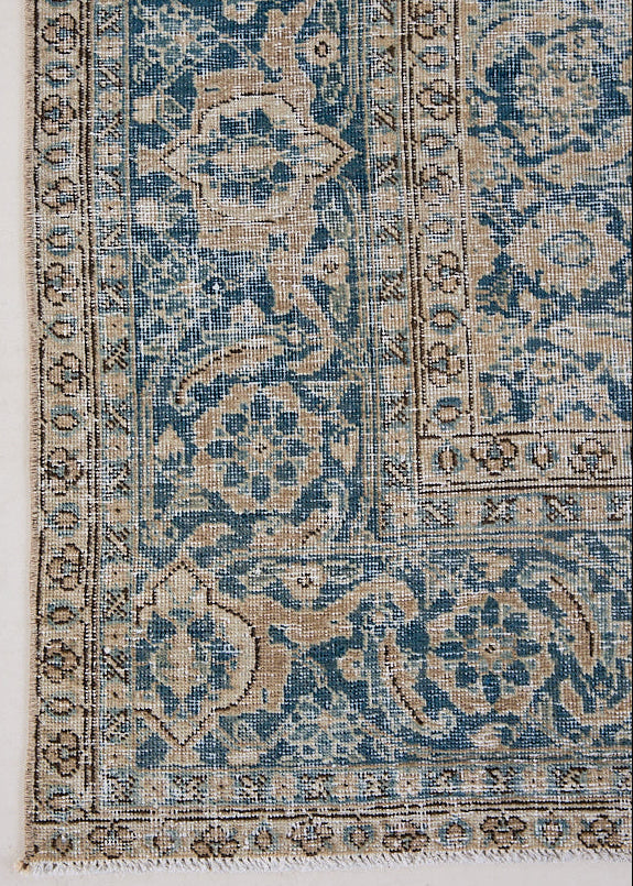 This is a handmade antique Tabriz rug, woven in Persia. The Tabriz region is known for producing some of the most ornate Persian carpets, often known for their mesmerising and intricate repeating patterns.