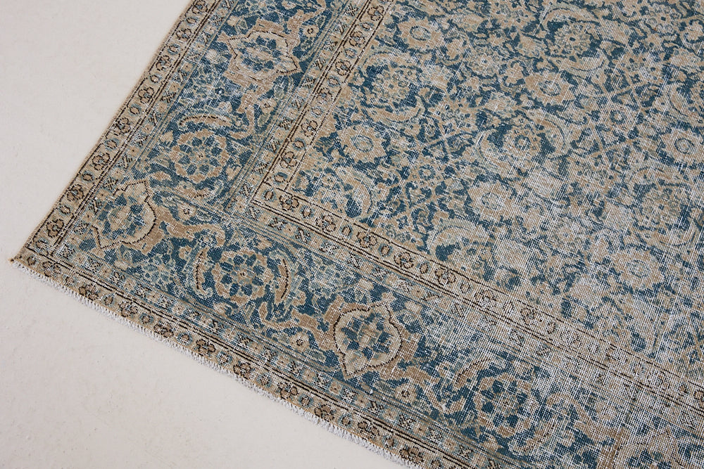 This is a handmade antique Tabriz rug, woven in Persia. The Tabriz region is known for producing some of the most ornate Persian carpets, often known for their mesmerising and intricate repeating patterns.
