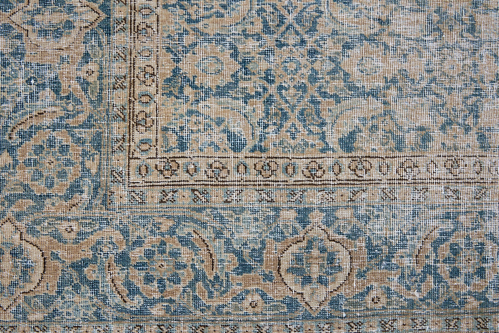 This is a handmade antique Tabriz rug, woven in Persia. The Tabriz region is known for producing some of the most ornate Persian carpets, often known for their mesmerising and intricate repeating patterns.