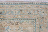 A hand knotted Persian runner from the Tabriz region. Featuring an intricate pattern in blue and beige tones