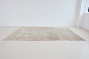 Cecil is a beautiful antique Persian Tabriz rug with a soft and subtle colour palette and in an extra large size. This pretty carpet features highly detailed flowers, palmettes, arabesques and leafy sprays throughout the field and borders, symbolising nature and beauty.