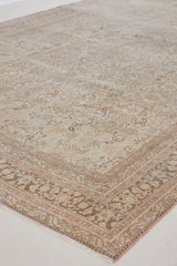 Cecil is a beautiful antique Persian Tabriz rug with a soft and subtle colour palette and in an extra large size. This pretty carpet features highly detailed flowers, palmettes, arabesques and leafy sprays throughout the field and borders, symbolising nature and beauty.