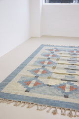 Erin is an original röllakan by the textile designer Karin Jonsson. This vintage rug features a beautiful and unique blue, pink and green colour palette and a geometric design.