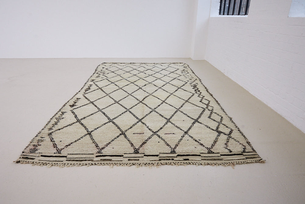 Indie is a vintage Beni Ourain carpet from the middle Atlas mountains located in Morocco. This is a unique rug and a real piece of history that would work well in any interior.