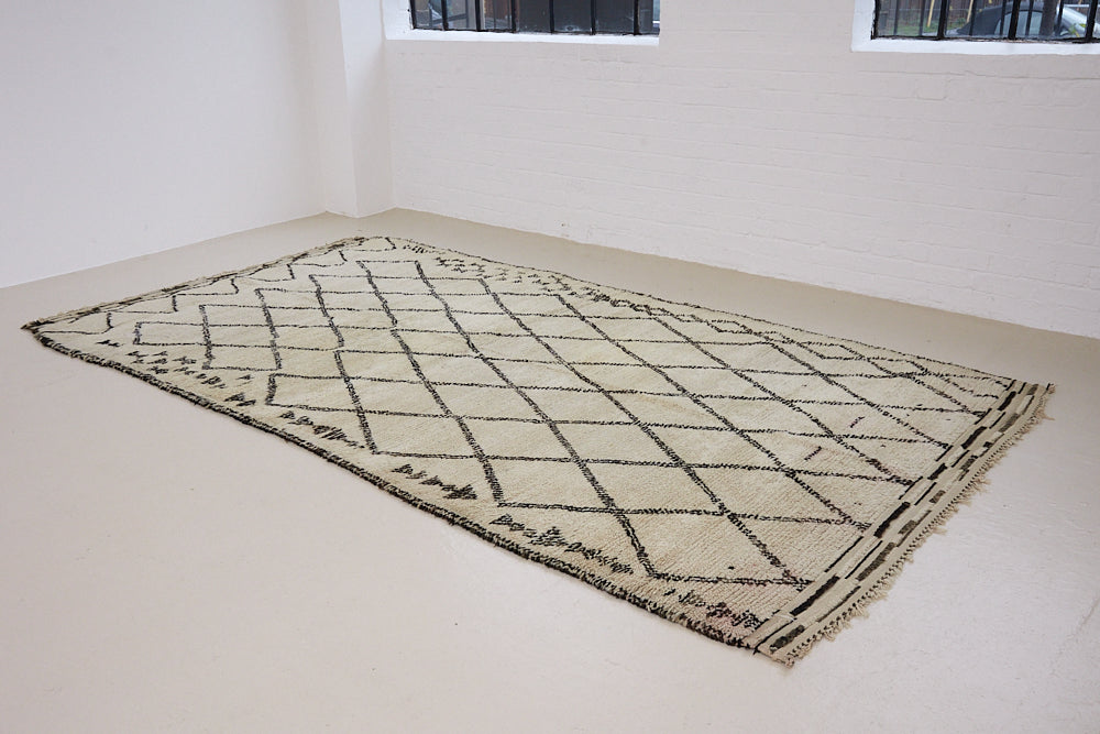 Indie is a vintage Beni Ourain carpet from the middle Atlas mountains located in Morocco. This is a unique rug and a real piece of history that would work well in any interior.