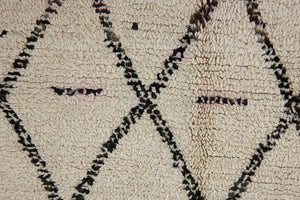 Indie is a vintage Beni Ourain carpet from the middle Atlas mountains located in Morocco. This is a unique rug and a real piece of history that would work well in any interior.