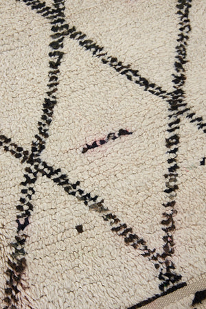 Indie is a vintage Beni Ourain carpet from the middle Atlas mountains located in Morocco. This is a unique rug and a real piece of history that would work well in any interior.