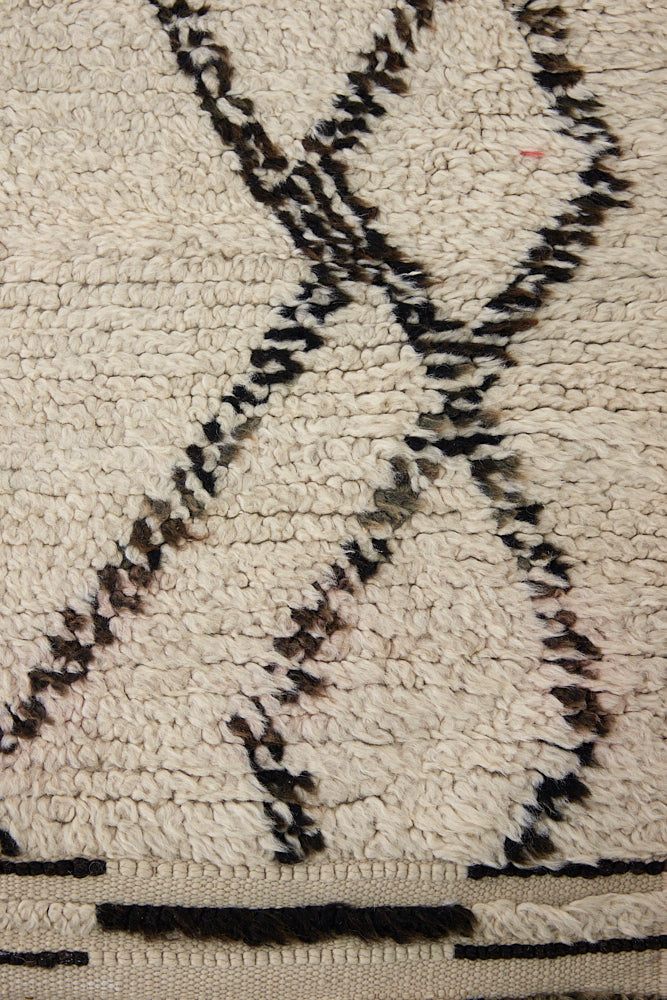 Indie is a vintage Beni Ourain carpet from the middle Atlas mountains located in Morocco. This is a unique rug and a real piece of history that would work well in any interior.