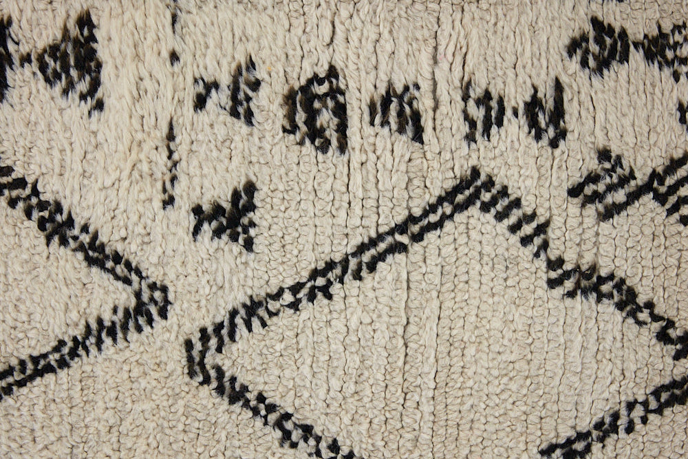 Indie is a vintage Beni Ourain carpet from the middle Atlas mountains located in Morocco. This is a unique rug and a real piece of history that would work well in any interior.