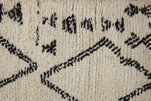 Indie is a vintage Beni Ourain carpet from the middle Atlas mountains located in Morocco. This is a unique rug and a real piece of history that would work well in any interior.