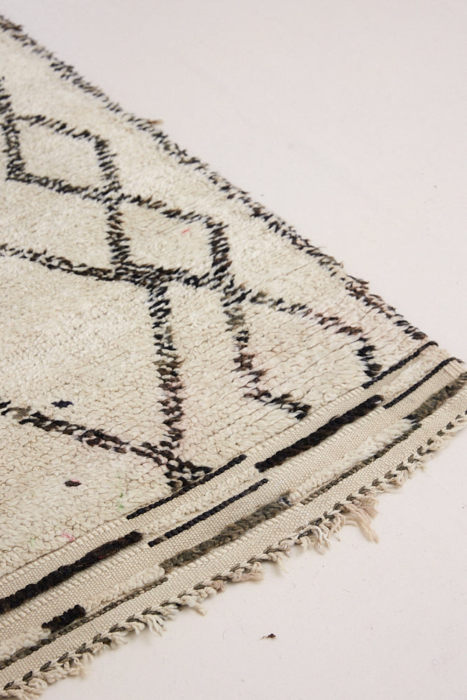 Indie is a vintage Beni Ourain carpet from the middle Atlas mountains located in Morocco. This is a unique rug and a real piece of history that would work well in any interior.