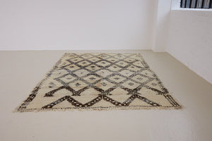 Remi is a vintage Beni Ourain carpet from the middle Atlas mountains in Morocco. Authentic Moroccan rugs are handwoven using a technique honed for decades and high grade natural wool. 