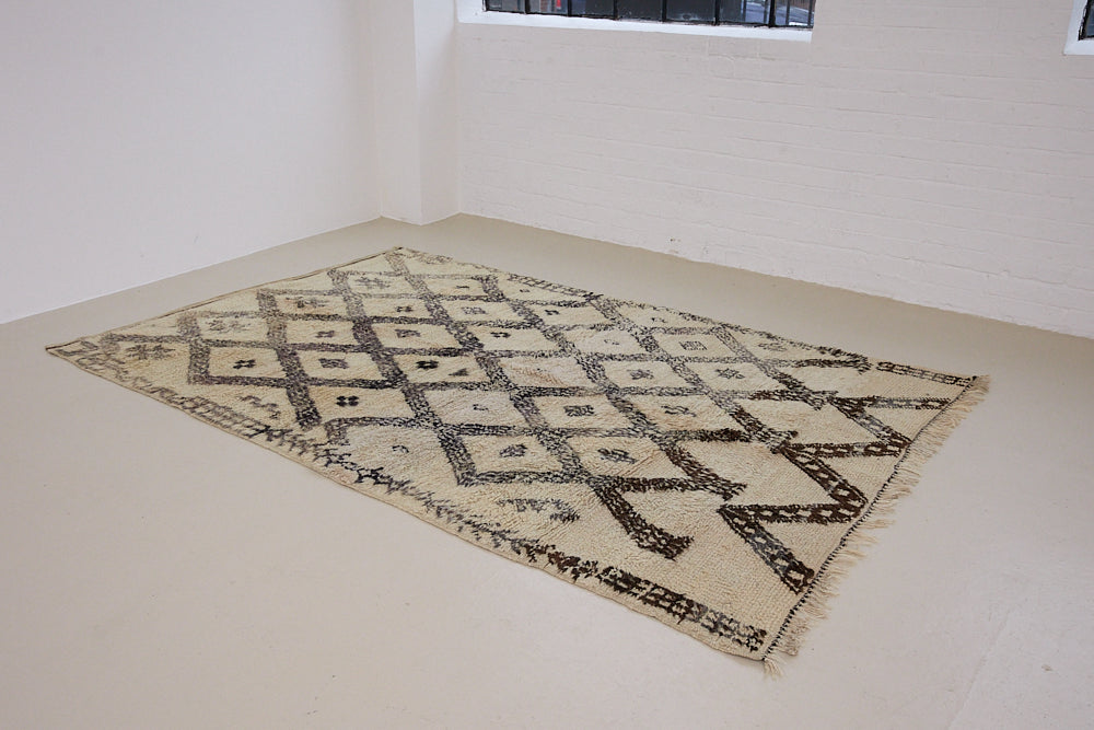 Remi is a vintage Beni Ourain carpet from the middle Atlas mountains in Morocco. Authentic Moroccan rugs are handwoven using a technique honed for decades and high grade natural wool. 