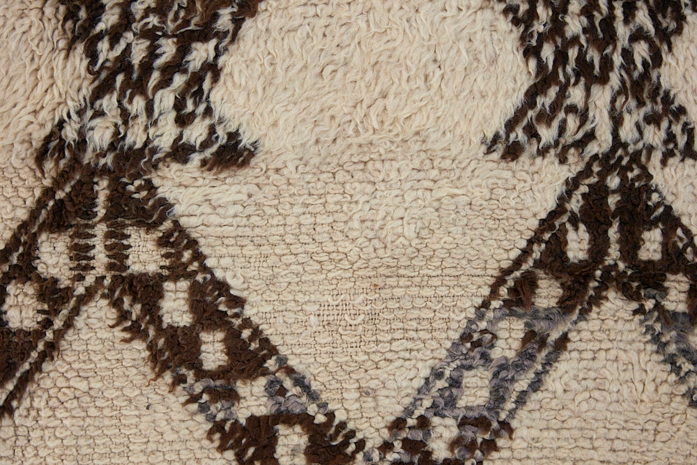 Remi is a vintage Beni Ourain carpet from the middle Atlas mountains in Morocco. Authentic Moroccan rugs are handwoven using a technique honed for decades and high grade natural wool. 