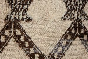 Remi is a vintage Beni Ourain carpet from the middle Atlas mountains in Morocco. Authentic Moroccan rugs are handwoven using a technique honed for decades and high grade natural wool. 