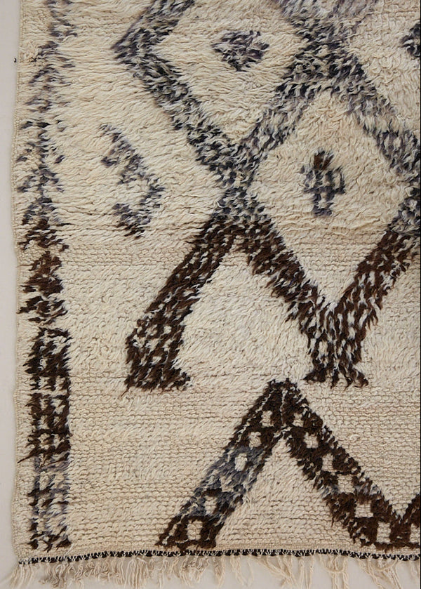 Remi is a vintage Beni Ourain carpet from the middle Atlas mountains in Morocco. Authentic Moroccan rugs are handwoven using a technique honed for decades and high grade natural wool. 