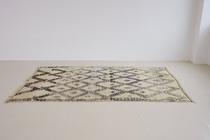 Remi is a vintage Beni Ourain carpet from the middle Atlas mountains in Morocco. Authentic Moroccan rugs are handwoven using a technique honed for decades and high grade natural wool. 