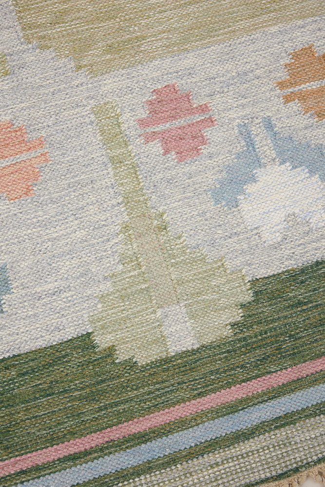Trudie is an original Swedish röllakan rug handwoven by mid-century textile designer Anna Johanna Angström. Green colour-way featuring floral motifs 