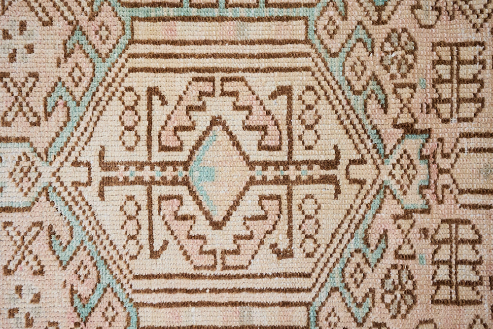 This is an vintage Persian Heriz runner which has been antique washed. Heriz carpets are some of the most sought after Persian designs and this rug features a classic Heriz design in gorgeous soft blue, taupe and cream tones. 