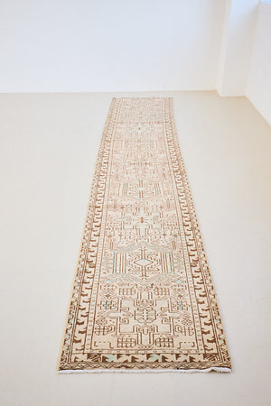 This is an vintage Persian Heriz runner which has been antique washed. Heriz carpets are some of the most sought after Persian designs and this rug features a classic Heriz design in gorgeous soft blue, taupe and cream tones. 