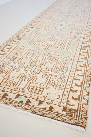 This is an vintage Persian Heriz runner which has been antique washed. Heriz carpets are some of the most sought after Persian designs and this rug features a classic Heriz design in gorgeous soft blue, taupe and cream tones. 