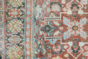 Mahals are known for decorative designs and repeating floral patterns. This antique rug features a beautiful earthy red ground complimented by a dark blue border.