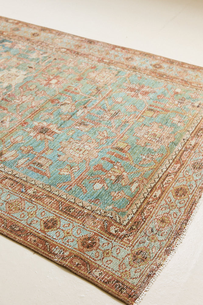 Alina an antique Persian Malayer rug with a blue field and an earthy pink intricate all over floral design