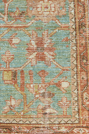 Alina an antique Persian Malayer rug with a blue field and an earthy pink intricate all over floral design
