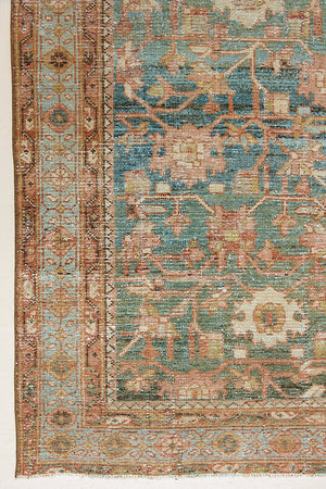 Alina an antique Persian Malayer rug with a blue field and an earthy pink intricate all over floral design