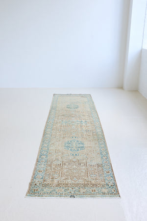 The Heriz is one of the most sought after and recognisable Persian designs, known for vibrant colours and bold geometric patterns. This runner features a beautiful colour palette of taupe, blue and muted brown.