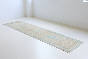 The Heriz is one of the most sought after and recognisable Persian designs, known for vibrant colours and bold geometric patterns. This runner features a beautiful colour palette of taupe, blue and muted brown.