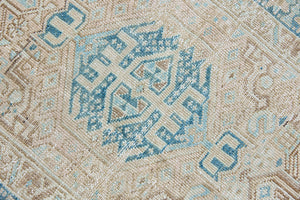 The Heriz is one of the most sought after and recognisable Persian designs, known for vibrant colours and bold geometric patterns. This runner features a beautiful colour palette of taupe, blue and muted brown.