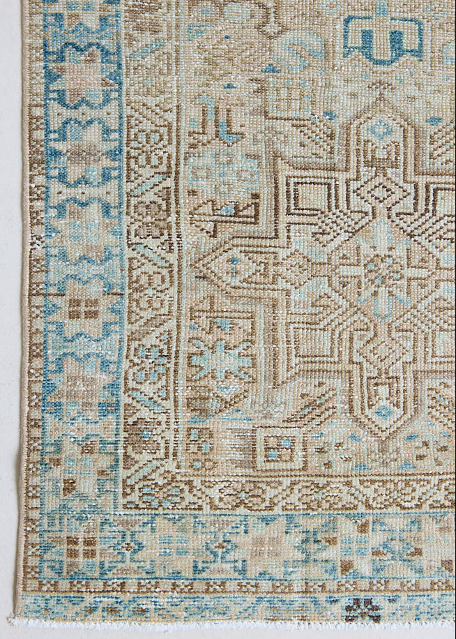 The Heriz is one of the most sought after and recognisable Persian designs, known for vibrant colours and bold geometric patterns. This runner features a beautiful colour palette of taupe, blue and muted brown.