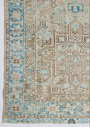 The Heriz is one of the most sought after and recognisable Persian designs, known for vibrant colours and bold geometric patterns. This runner features a beautiful colour palette of taupe, blue and muted brown.