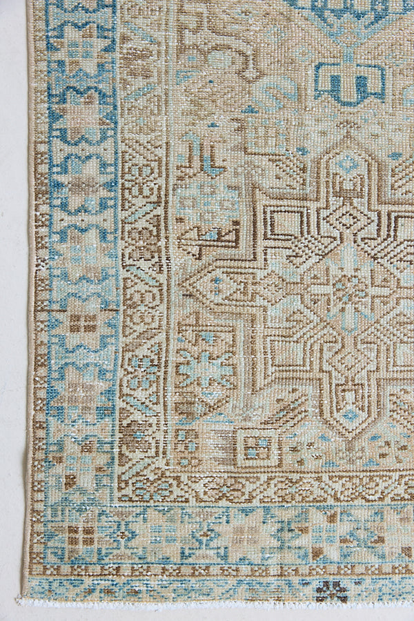 The Heriz is one of the most sought after and recognisable Persian designs, known for vibrant colours and bold geometric patterns. This runner features a beautiful colour palette of taupe, blue and muted brown.