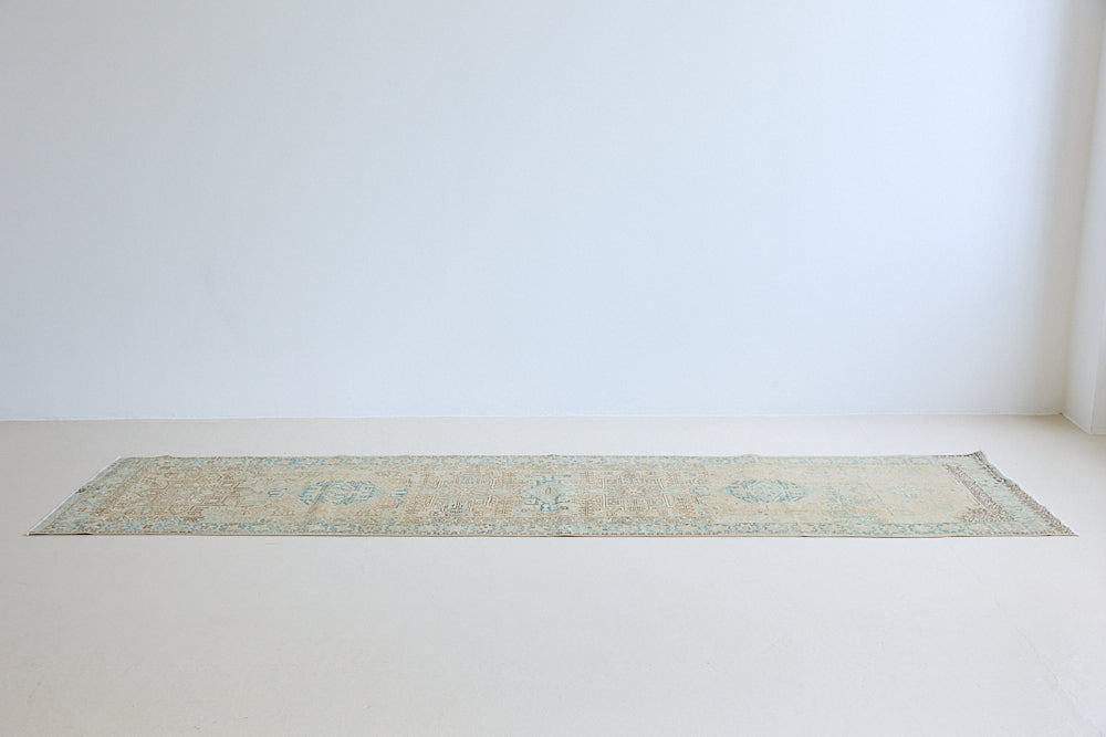 The Heriz is one of the most sought after and recognisable Persian designs, known for vibrant colours and bold geometric patterns. This runner features a beautiful colour palette of taupe, blue and muted brown.